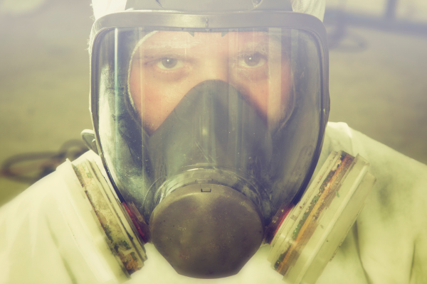 Man wearing full face respirator mask